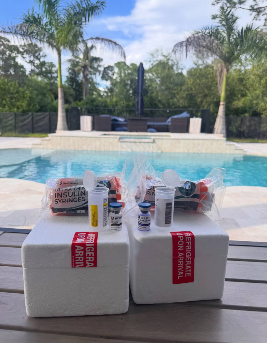 A real patient order: medication vials, syringes, and supplies packed in refrigerated shipping boxes